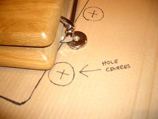 Close up of a toilet seat template's hinges 